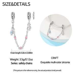 Detail of S925 silver safety chain with boy and girl pendants and colorful zircon stones