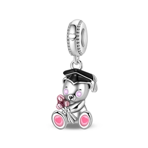 Close-up of a silver graduation bear charm with a black mortarboard and pink flowers