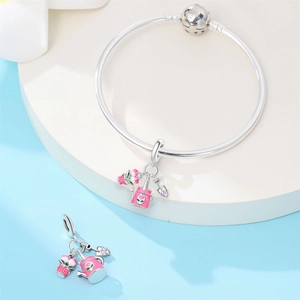 Detailed close-up of S925 silver garden-themed charms with pink enamel watering can