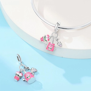 Gardening charm set with pink enamel watering can, flower pot, and shovel in silver finish