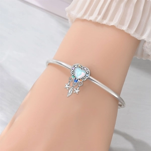 Silver dreamcatcher bracelet detail with heart opal and colorful gemstone charms