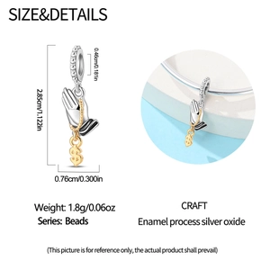 Silver bead showing praying hands with gold dollar sign charm and size dimensions