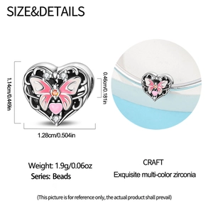 Macro view of heart charm with pink butterfly and cubic zirconia showing dimensions