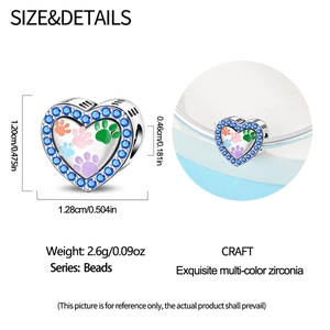 Detailed size view of silver heart charm with colorful paw prints and blue zircons