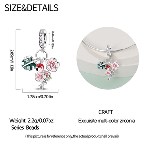 Detailed view of pink flamingo charm with tropical leaves and zircon inlays