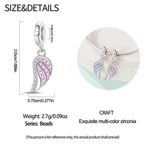 Detailed view of silver wing charm with pink zircon stones and size measurements