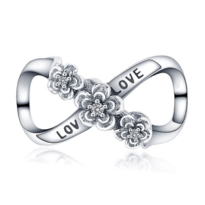 Detailed view of silver infinity charm with flowers and LOVE engraving for bracelets