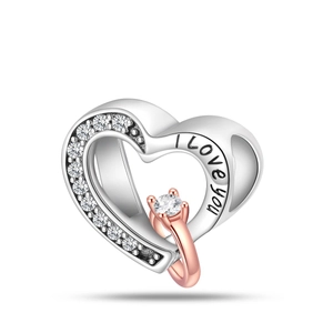 Detailed view of hollow heart charm with I Love You engraving and rose gold ring