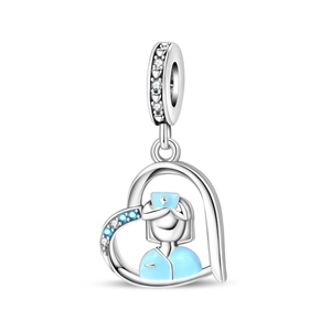 Detail of silver nurse heart charm with blue enamel and sparkling crystal stones