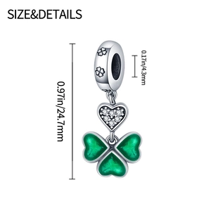 Detail of silver clover charm showing 24.7mm height and green enamel heart texture