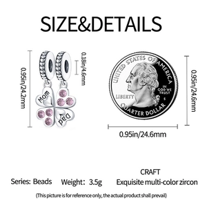Detailed view of silver clover charm with Mom and Dad engraving and pink crystals