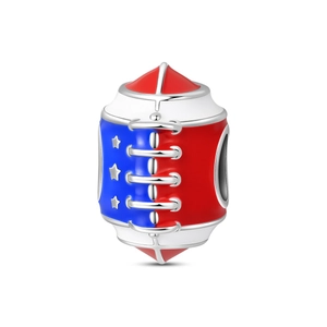 Detail of rugby charm with red, white, and blue enamel stars and silver metallic finish
