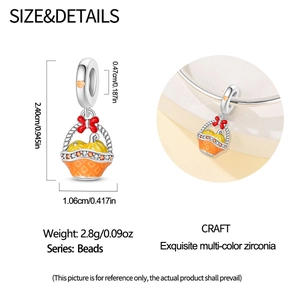 Macro detail of pumpkin basket charm with colorful zircons and size specifications