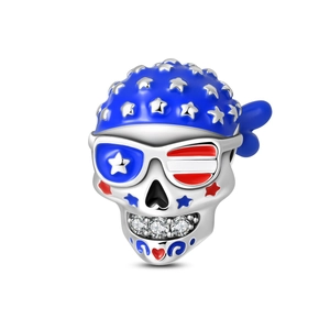 Macro detail of punk skull charm with American flag enamel and zircon stone inlay