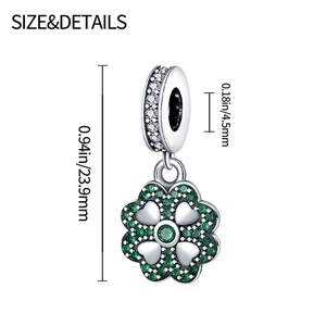Detail of silver clover charm with green cubic zirconia and size specifications