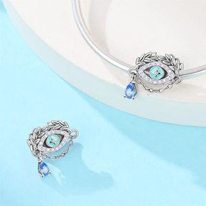 Silver Evil Eye charm with blue zircon teardrop pendant on a stylish snake chain bracelet