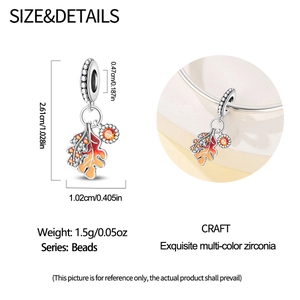 Detail of maple leaf pendant with orange zirconia showing exact dimensions and usage