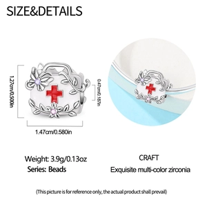 Detail view of first aid kit charm in silver with red cross and colorful zircons