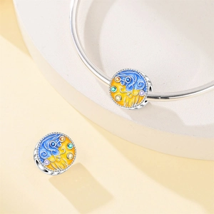 Detail of S925 silver charm bead with blue and yellow enamel starry night pattern
