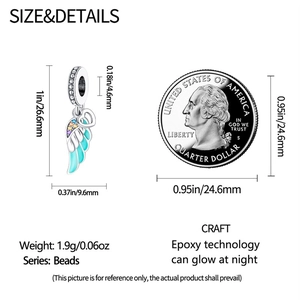Size comparison of silver angel wing heart charm with blue epoxy and gemstone detail