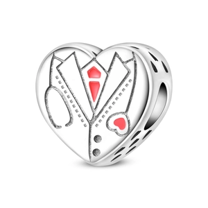 Detailed macro view of heart-shaped medical charm with red stethoscope and tie design