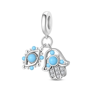 Detailed close-up of silver Hamsa Hand and Evil Eye charm with blue beads and zircons