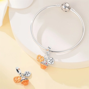 Detail of S925 silver fall charms featuring orange pretzel and Hello Fall heart pendant