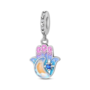 Macro detail of Hamsa Hand charm with enamel moon and blue star zircon inlay