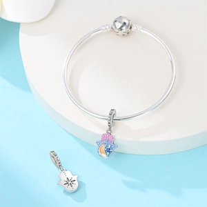 Silver Hamsa Hand charm bracelet with blue gradient enamel moon and star details