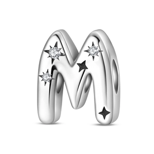 Close-up of silver letter M charm bead with sparkling zircons and black star motifs