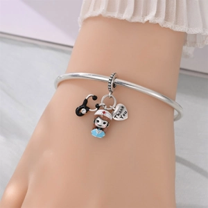 Silver bracelet featuring nurse charms including a stethoscope and a Thank You heart charm