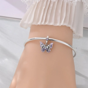 Silver-plated open bracelet with a purple enamel butterfly charm and sparkling zircons