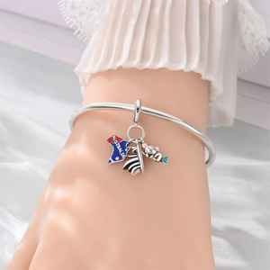 Detailed view of silver charm bracelet featuring Australia map, Opera House, and koala charms