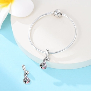 Detail of silver snake chain bracelet with crystal infinity heart charms and Forever Love engraving