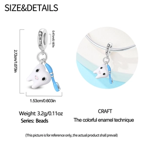 Detail of silver tooth and toothbrush charm with blue enamel and dimensions