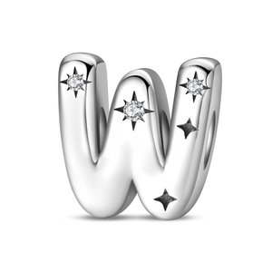 Macro shot of silver letter W charm with sparkling star zircon stones for DIY jewelry