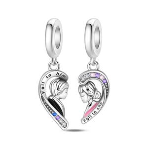 Detail of silver couple puzzle charms with colorful zircons and engraved romantic phrases