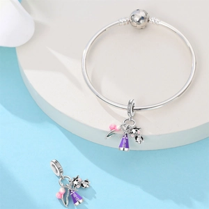 Silver Holland charm bracelet with pink tulip, purple windmill and engraved cow charm