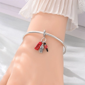 Silver London charm bracelet featuring Big Ben, red phone booth and royal guard charms