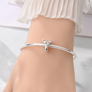 Silver letter Y charm bracelet with star engraving and crystals on female wrist