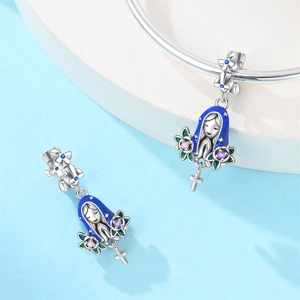 Detail of silver Virgin Mary charm with blue enamel cloak and colorful zircon stones