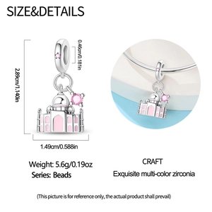 Macro detail of silver Taj Mahal charm with pink enamel and sparkling zirconia stones