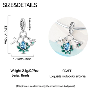 Detailed view of silver charm bead with blue zircon and cross design for bracelet