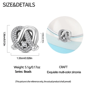 Detailed view of silver charm bead with zirconia inlay showing 1.33cm size and weight