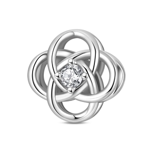 Detailed close-up of a silver intertwined Celtic knot charm with a central round zircon