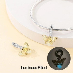 Luminous firefly charm in gold finish with S925 silver clasp on a snake chain bracelet