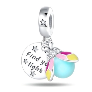 Detailed view of luminous firefly charm with Find your light engraving and enamel