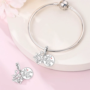 Detail of silver snake chain bracelet featuring Home Sweet and I Love Dad heart charms