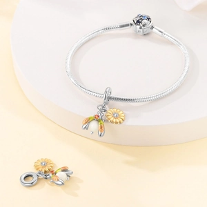Sterling silver snake chain bracelet featuring sunflower and honey bee charms with zircon
