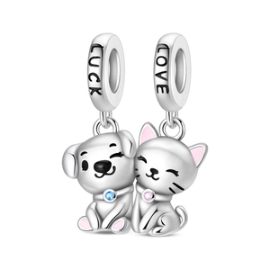 Detail of silver cat and dog charms with pink enamel and LUCK LOVE engraved loops